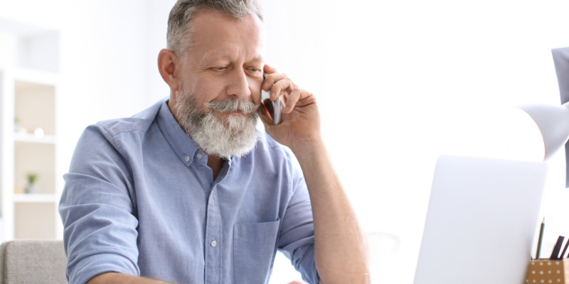 older man on the phone