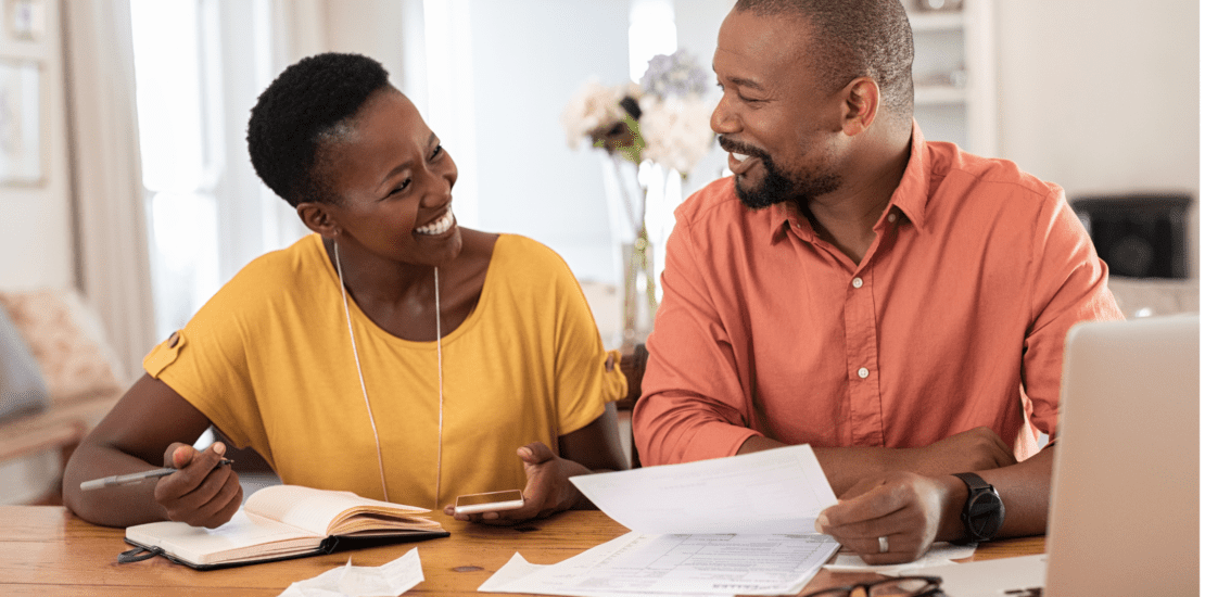 Smiling couple with paperwork